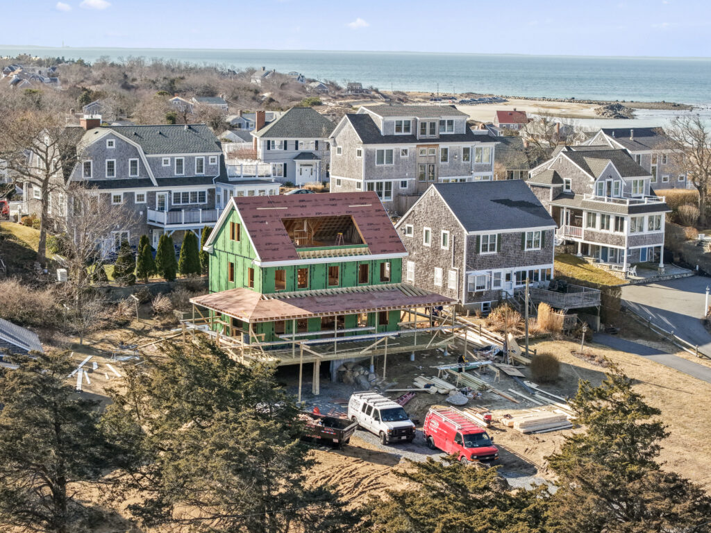 Custom home under construction on Cape Cod, framed and ready for exterior finishing