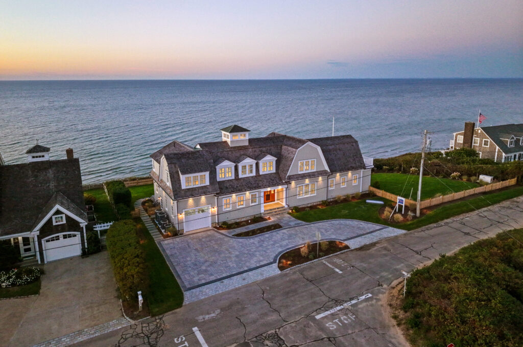 Aerial shot of a custom home on luscbome lane in dennis massachusetts on the water